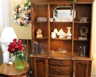 This china/display cabinet is shown without glass front doors.  Doors are stored to the left of the cabinet.