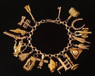 Ladies Gold Charm Bracelet with Eighteen Federal Style Gold Charms 