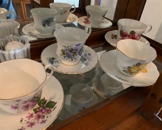 various tea cups/saucers