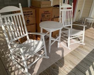White wooden rockers and small table. (3 rodkers total)