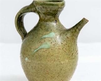 Signed 6 and half in Green Ceramic Jug