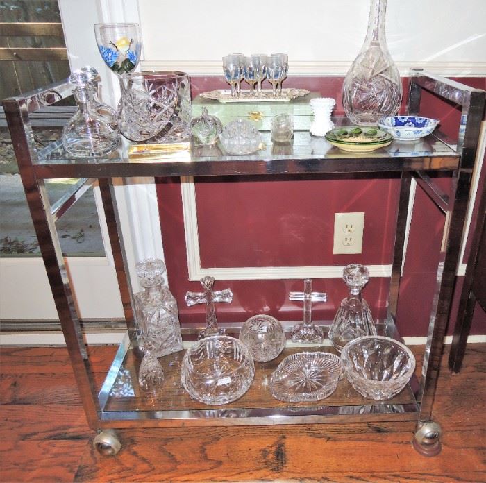 Chrome bar cart with crystal. Baccarat Tallyrand Decaner, Waterford bowls and crosses, Kosta Boda bowl, heavy etched and cut glass