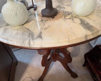 Perfect Condition Marble Top Table $275 Available for Pre Sale.                                                                  Call Donna at 850-516-2425. 