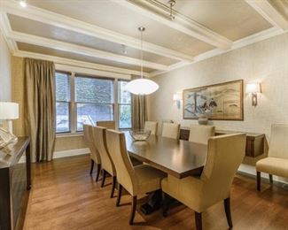 Custom table and 8 chairs (2 arm chairs and 6 side chairs). Rough measurements of the table are 10 1/2' x 4 1/2'. Chairs have been reupholstered.