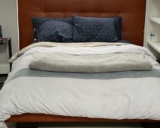 Custom-Leather Upholstered Queen Bed Frame. Measures 76"W x 51" H. 
