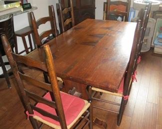 PINE TABLE WITH LADDER BACK CHAIRS.