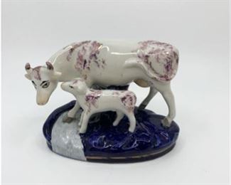 Lot 061
Old Staffordshire Ware Cow with Calf'