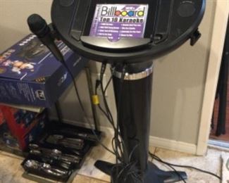 Karaoke machine, broke the mic holder on one side but holds three at once, plug into your speakers, cd included, plays CDs too