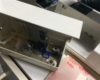 Accessories inside the cleverly hidden front compartment of the Bernese 680 sewing machine