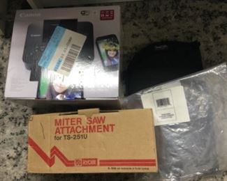 Miter saw attachment, new in box, selphy photo printer new in box, kayak paddle cushion