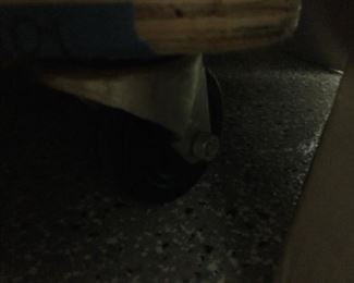 Hard to see but rollers big super heavy duty, cost as much as we are selling entire shelf for
