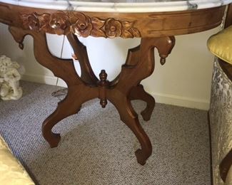 1960s marble top table with carved flowers
