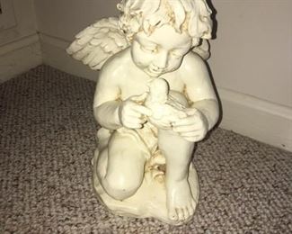 cherub statue holding dove