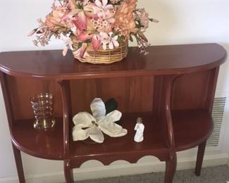 small cherry side display table with floral arrangement this table is one of two tables 