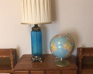 mid century lamp with shade in excellent condition, world globe sits on maple table between two matching twin maple beds