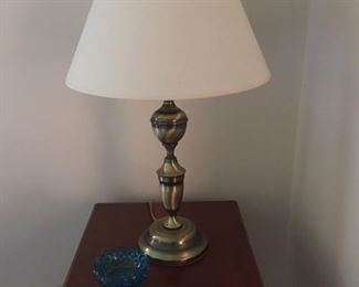 old polished brass lamp and moon and stars glassware