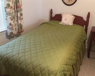 one of two cherry matching twin beds