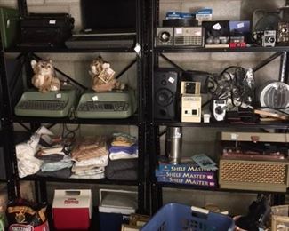 wonderful assortment of baskets, typewriters , cameras, coolers, and more