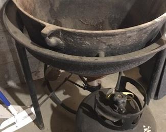 cast iron kettle on stand