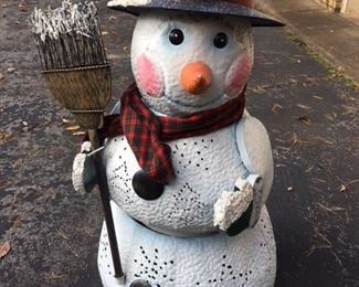 4 feet snow man tin punch snowman that looks so stunning at night time and does have lights included
