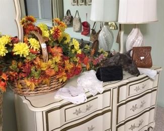 fall floral arrangement, old vintage lamp, hang bags, various linens