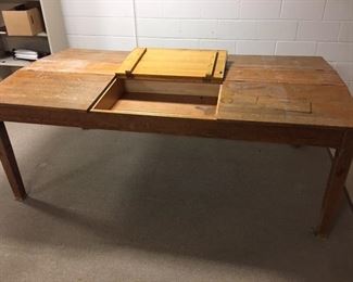 large oak drawing and work table where the middle opens up with each section repeating 