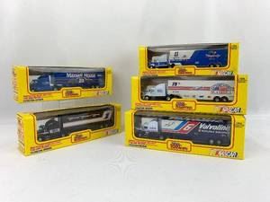 5 collectible die cast Nascar cab and trailers