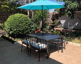 Patio dining table with 4 chairs and cushions, umbrella and stand