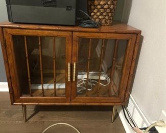 Mid century bamboo and glass cabinet with light.