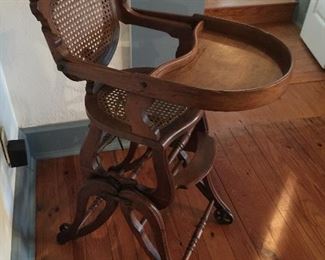 Vintage high chair that converts into a chair on rollers great condition 
