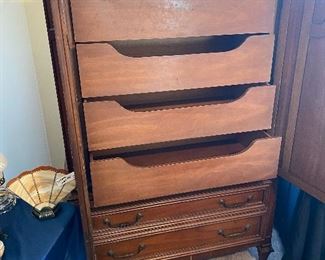 Armoire open with unique drawers
