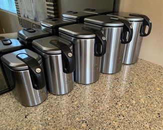 Simple human canister set of 5 stainless steel sealing canisters		
