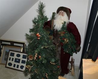 Large Santa - Asking $60 & tall Christmas tree, asking $30.  There is also a large Christmas tree available for $60