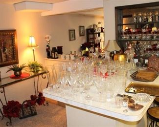 Lots of glassware.  Kings Crown stemware shown on the back shelves.