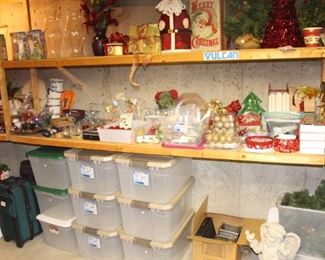 The shelves in the storage area are full of Christmas, kitchen and storage items.