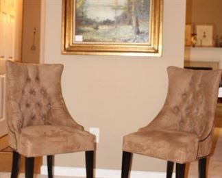Pair of chairs and oil painting.