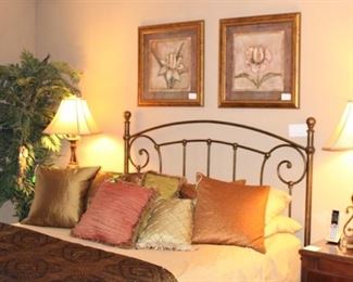 Queen size bed, lots of decorator pillows, lamps and more.
