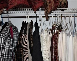 Tablecloths, decorative pillows, coats and jackets fill this closet.