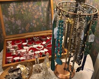 Vintage jewelry including sterling silver bracelets, rings, necklaces, and turquoise necklaces.