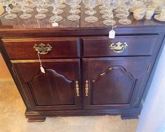 Mahogany server with hints of some of the stemware
