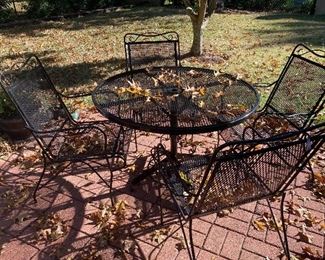Freshly painted iron patio furniture - leaves are free decorations