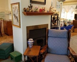 Beautiful Blue Chair and wonderful small table.  Notice the Thai Print over the mantle.