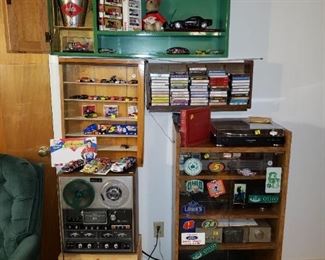 Stereo cabinet with Tuner and Tape Player and Record Player.  Note Red Record Album - complete with vintage 45's. The Green shelf is also for sale! Akai Reel-to Reel has been sold.