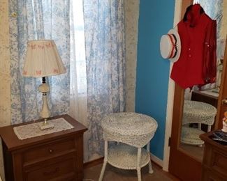 Night Stand for Bed and lovely little white wicker table.  Note the Red Vest and White Hat - ready for a Barber Shop Quartet?
