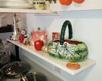 Closeup of teapots and ceramic basket - tupperware measuring cups in orange :)