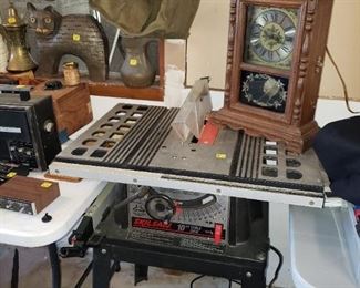 Table Saw, antique clock.