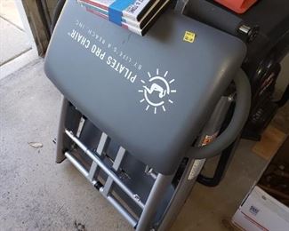 Pilates Workout Chair with instruction tapes.