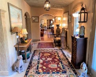 Tufenkian handmade rugs, antique tables, lamps, art, chandeliers, life size vintage concrete St. Francis