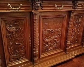 A closer look at the dragon carvings on the base of the hutch