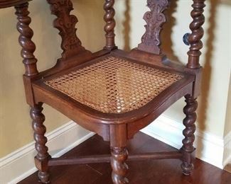 Antique and carved corner chair with tobacco twist legs